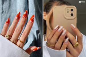 A imagem mostra unhas almond decoradas. À esquerda, esmalte laranja com margaridas brancas. À direita, unhas nude com design geométrico branco. Ambas exibem acessórios dourados e estilo sofisticado, destacando tendências modernas de nail art.